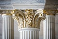 close-up of corinthian capital on a marble column inside a corporate office