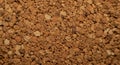 Close-up of a cork surface, showing its granular texture and warm brown coloration. Royalty Free Stock Photo
