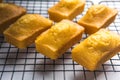 Close-up of corn muffins on plate with bowl of corn meal and additional muffins in the background Royalty Free Stock Photo