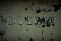 Close-up of corroded steel surface, with inscription \