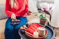 Close up of cosmetic bag with beauty products and brushes. Woman applying makeup at home holding mirror Royalty Free Stock Photo