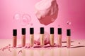 Close-up of cosmetic items on pink background