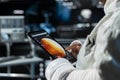 Close up of cosmonaut managing systems on device before Mars expedition Royalty Free Stock Photo