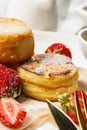 Close-up Cottage Cheese Pancakes with fresh strawberries and jam. Curd Cheese Pancakes on a white plate Royalty Free Stock Photo