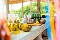 Close up of countertop with fruit, cocktail shaker, glasses, bottles at beach bar Royalty Free Stock Photo