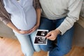 Close up of couple with baby ultrasound images Royalty Free Stock Photo