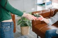 Close-Up of Couple Love Giving Present Together, Young Girl Surprise Gift to Her Boyfriend in The Living Room. Young Couple Love Royalty Free Stock Photo