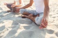 Close up of couple making yoga exercises outdoors Royalty Free Stock Photo