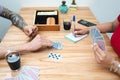 Close up of couple playing cards at home. Rummy game play. Selective focus Royalty Free Stock Photo