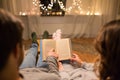 Close up of couple reading book at home Royalty Free Stock Photo