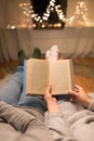 Close up of couple reading book at home Royalty Free Stock Photo