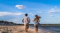 couple walking on the beach, boy and girl walking on the beach, couple together, couple running on the beach Royalty Free Stock Photo