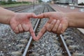 Close-up of couple& x27;s hands making a heart-shaped sign, valentine& x27;s day concept, expressing love. Royalty Free Stock Photo