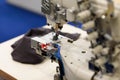 close up of coverstitch industrial sewing machine Royalty Free Stock Photo