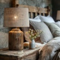 Cozy bedroom interior with rustic bedside table and lamp Royalty Free Stock Photo