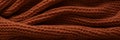Close-up banner of a cozy brown knitted blanket or sweater. AI Generated
