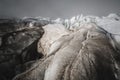 Close-up Crack is a deep blue crack found in the ice sheet and black mud on the glacier. Wide angle and dramatic sky Royalty Free Stock Photo