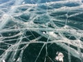 Crack of frozen Baikal lake texture in Siberia