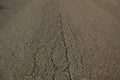 Close-up of cracked asphalt on a road