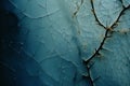 a close up of a cracked blue wall