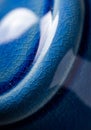 Close-up of a cracked ceramic surface with a deep blue glaze. The texture shows Royalty Free Stock Photo