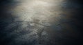 Close-up of Cracked Concrete Surface with Dramatic Lighting and Shallow Depth of Field texture Royalty Free Stock Photo