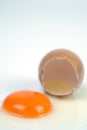 Cracked egg, eggshell with yolk isolated on white background Royalty Free Stock Photo