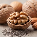 Kernel inside a shell, surrounded by whole walnuts and almonds in the Royalty Free Stock Photo
