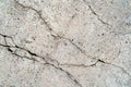 Close up of cracks in a dilapidated concrete wall