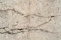 Close up of cracks in a dilapidated concrete wall