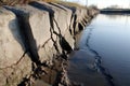 close-up of cracks in the levee structure, water seeping through