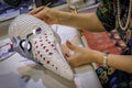 Close up of craftsman hands, making traditional Venetian carnival mask out of papier mache at a studio in Venice, Italy Royalty Free Stock Photo