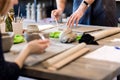 Close-up of a craftswoman working on the edges of a piece of brush clay for later gluing Royalty Free Stock Photo