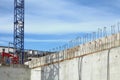 Close up of crane on the construction site of a concrete building Royalty Free Stock Photo