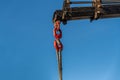 Close-up of crane hook lifting load