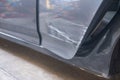 Crashed cars side area with scratched, Car paint stripping, deep scratches on a silver car with front rear door Royalty Free Stock Photo