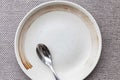 Cream-colored ceramic rice dishes with Asian motifs and small spoon