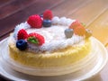 Close up. Creamy mascarpone cheese cake with strawberry and winter berries. Japanese Cheesecake. Close up. Christmas dessert.