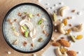 Close-up of Creamy Sabudana Kheer Garnished with dry fruits. Indian delicious dessert. Served in a black bowl. Top View on white Royalty Free Stock Photo