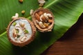 Close-up of Creamy Sabudana Kheer Garnished with dry fruits. Indian delicious dessert. Served in a coconut shell. on banana leafna Royalty Free Stock Photo