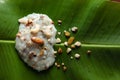 Close-up of Creamy Sabudana Kheer Garnished with dry fruits. Indian delicious dessert. Served in green banana leaf.