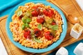 Creamy tomato risotto with pesto, top view Royalty Free Stock Photo