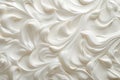 Close up of creamy white vanilla yogurt on a spoon, top view with full background coverage