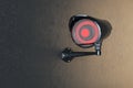 Close up of creative black CCTV camera on concrete wall background. Supervision concept. Royalty Free Stock Photo