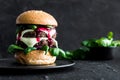 Close-up of creative homemade tasty burger with two beef patty