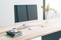 Close up of creative wooden designer desktop with empty mock up computer monitor, coffee cup, other items, window with city view