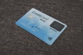 Close up of credit biometric card belonging to abstract cardholder lying on coarse fabric. E-shopping using advantages of Royalty Free Stock Photo