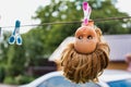 Photo of creepy doll hanging at barn