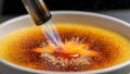 Close-up of Creme Brulee Being Torched. Royalty Free Stock Photo