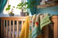 close-up of crib with soft baby blanket and mobile